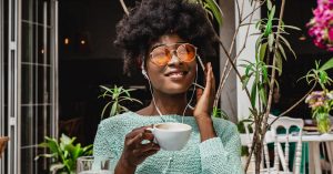 black woman listening to podcast